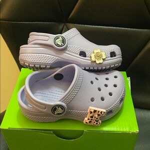 CROCS purple w/3charms for baby girl
